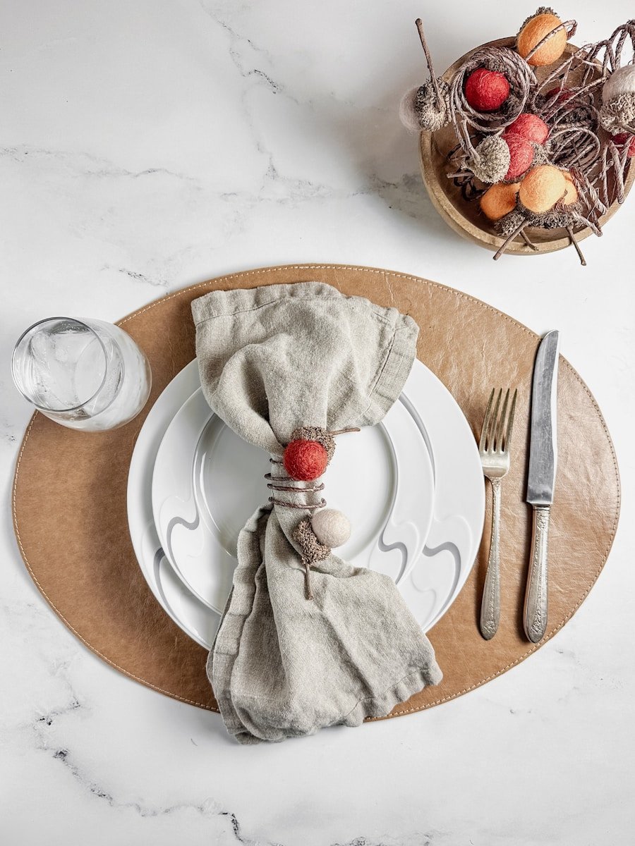 Table setting with festive napkin rings and autumn decor