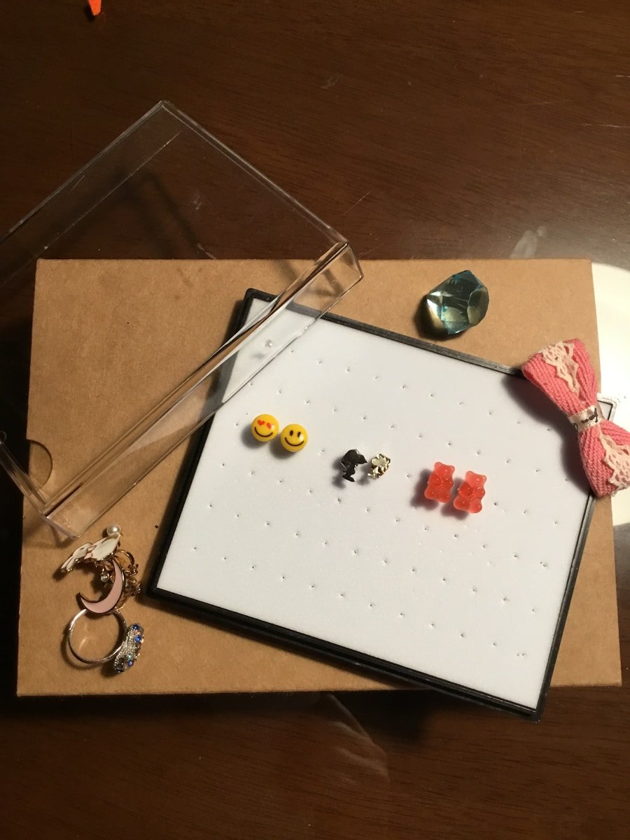 silver and black beaded bracelet on white paper