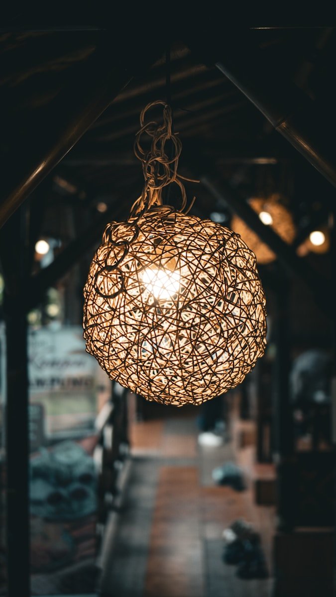 A light hanging from a ceiling in a building