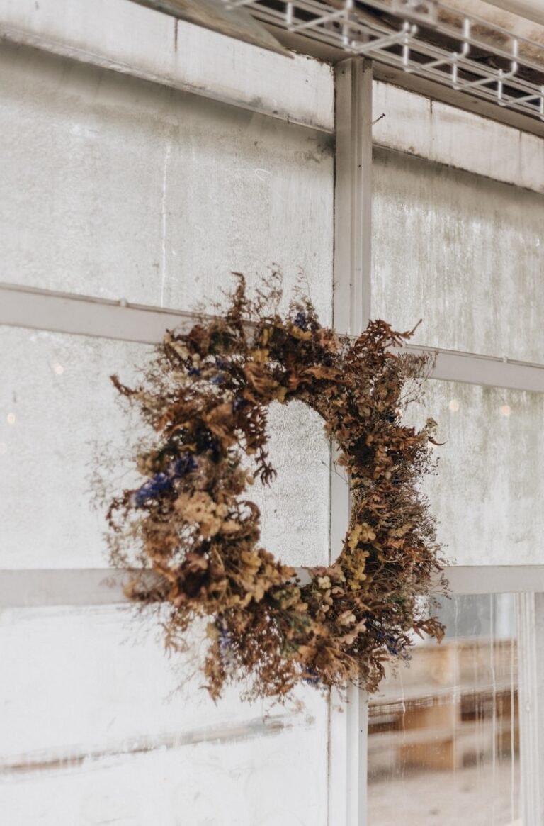 A wreath hanging on the side of a building