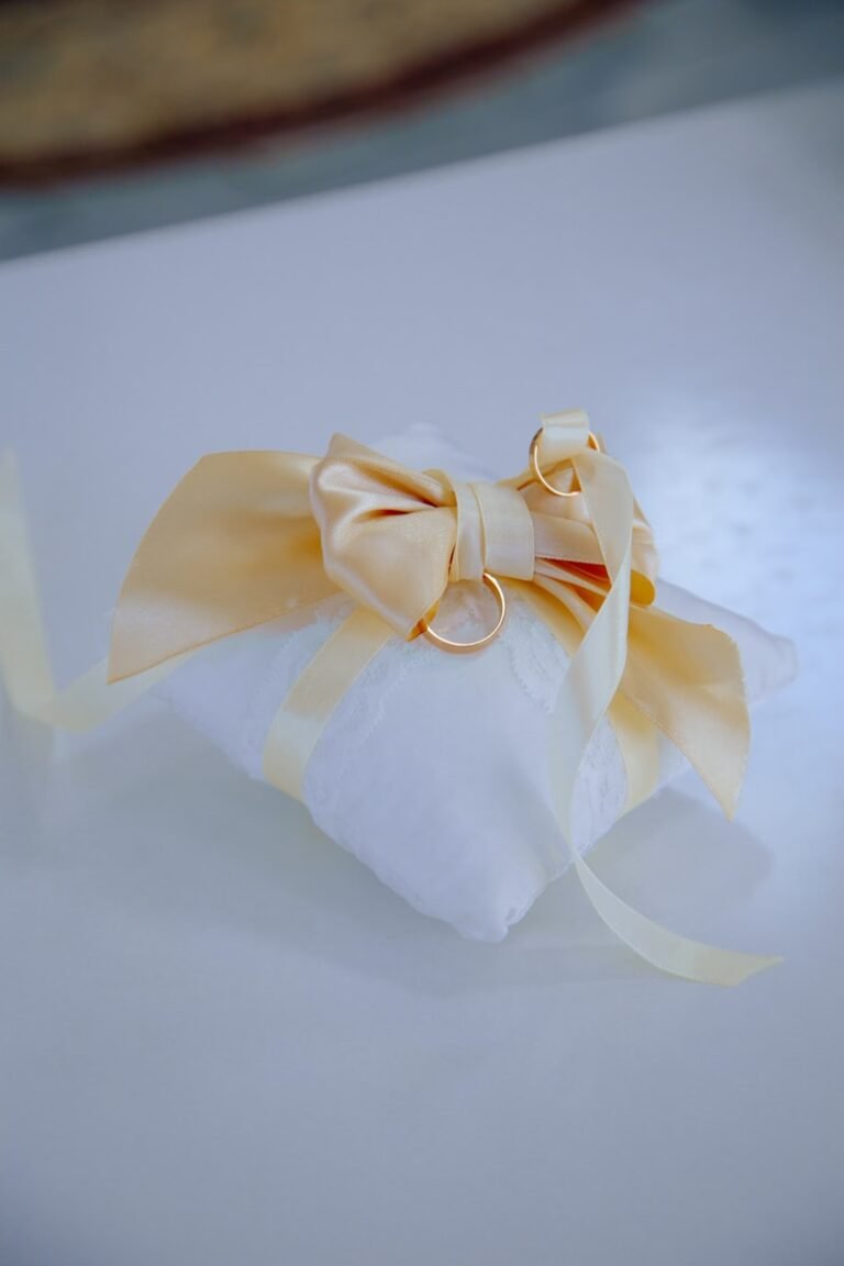 a white bag with a yellow bow on it