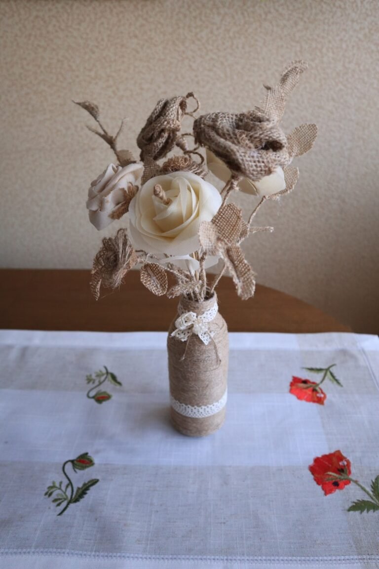 A vase filled with flowers sitting on top of a table