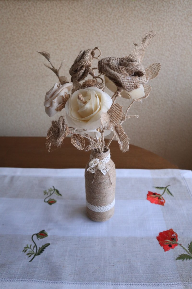 A vase filled with flowers sitting on top of a table