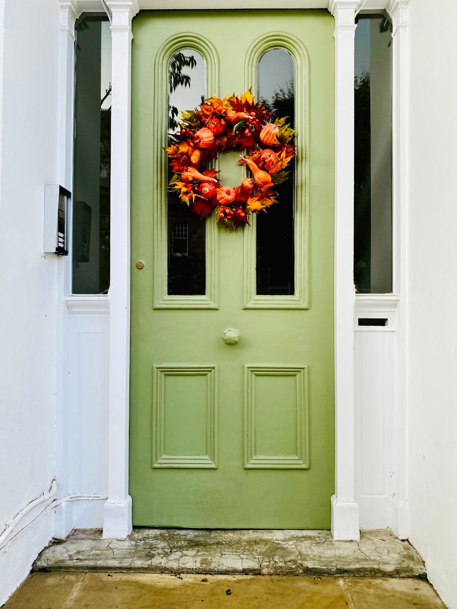 a green door with a wreath on it