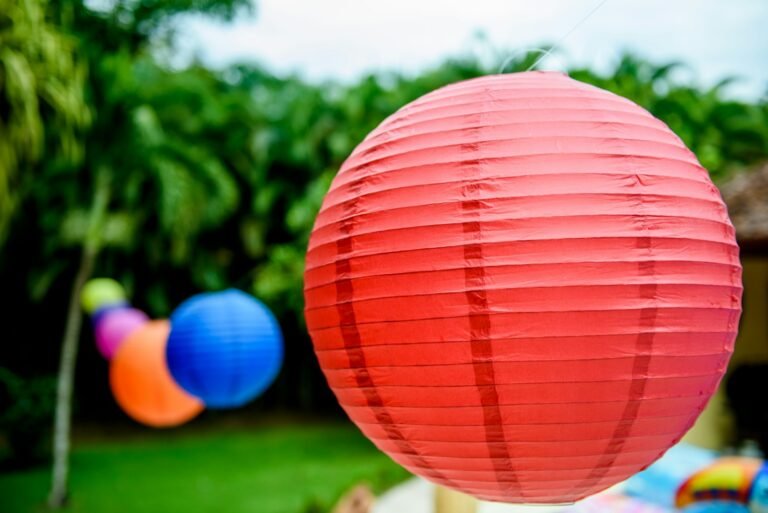 red ball on green grass during daytime