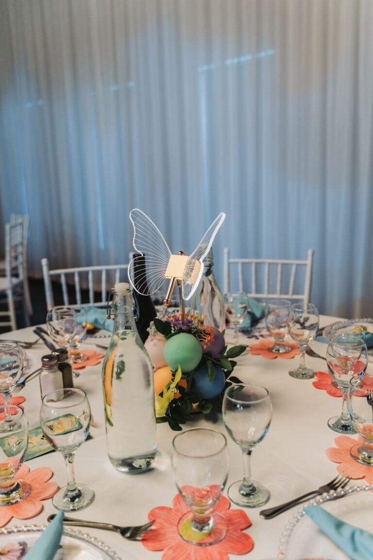 Table setting with butterfly centerpiece and colorful decorations