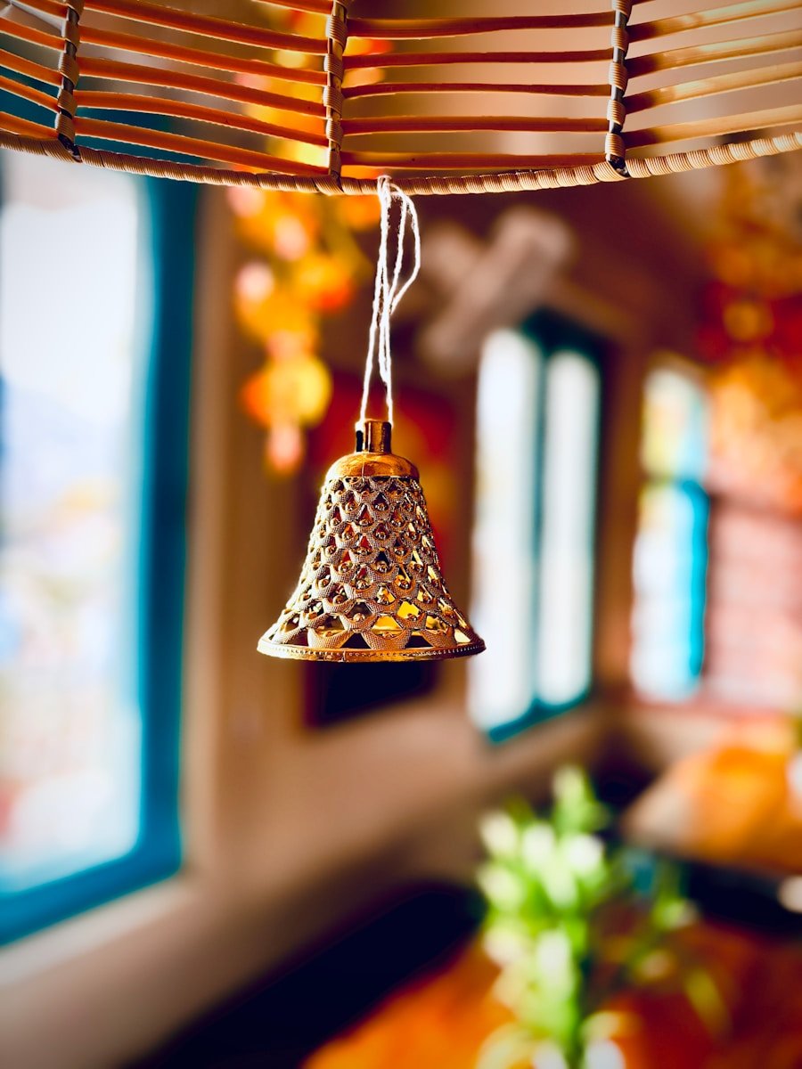 a close up of a bell hanging from a ceiling