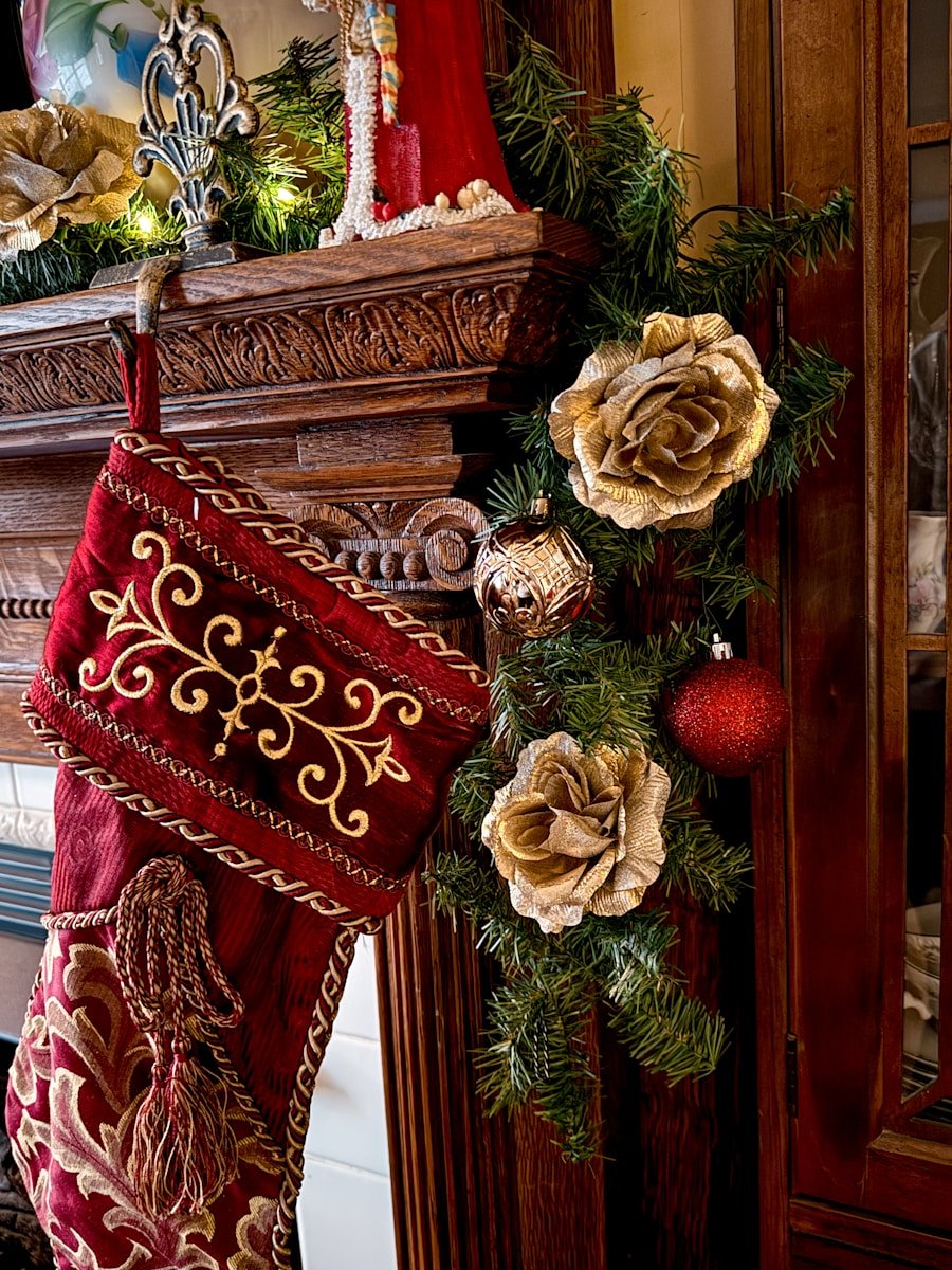 Christmas stocking hangs on decorated fireplace mantel
