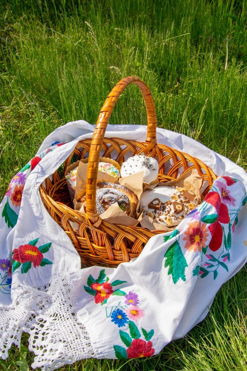 Easter bread in a wicker basket on a cloth.