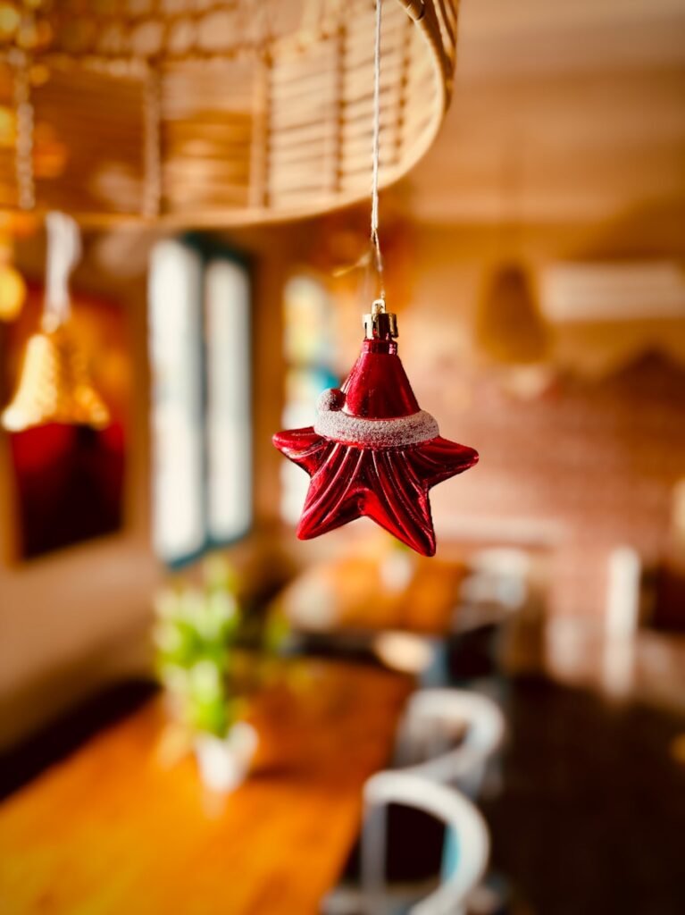 a red star ornament hanging from a ceiling
