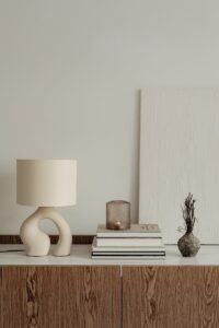 a lamp and books on a table